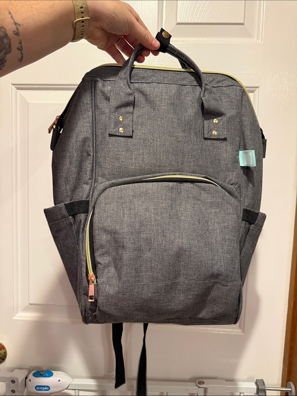 Stylish Gray Baby Diaper Backpack with Gold Accents